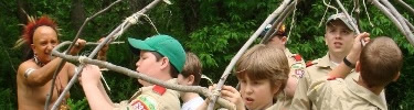 Boy scouts building a wigwam